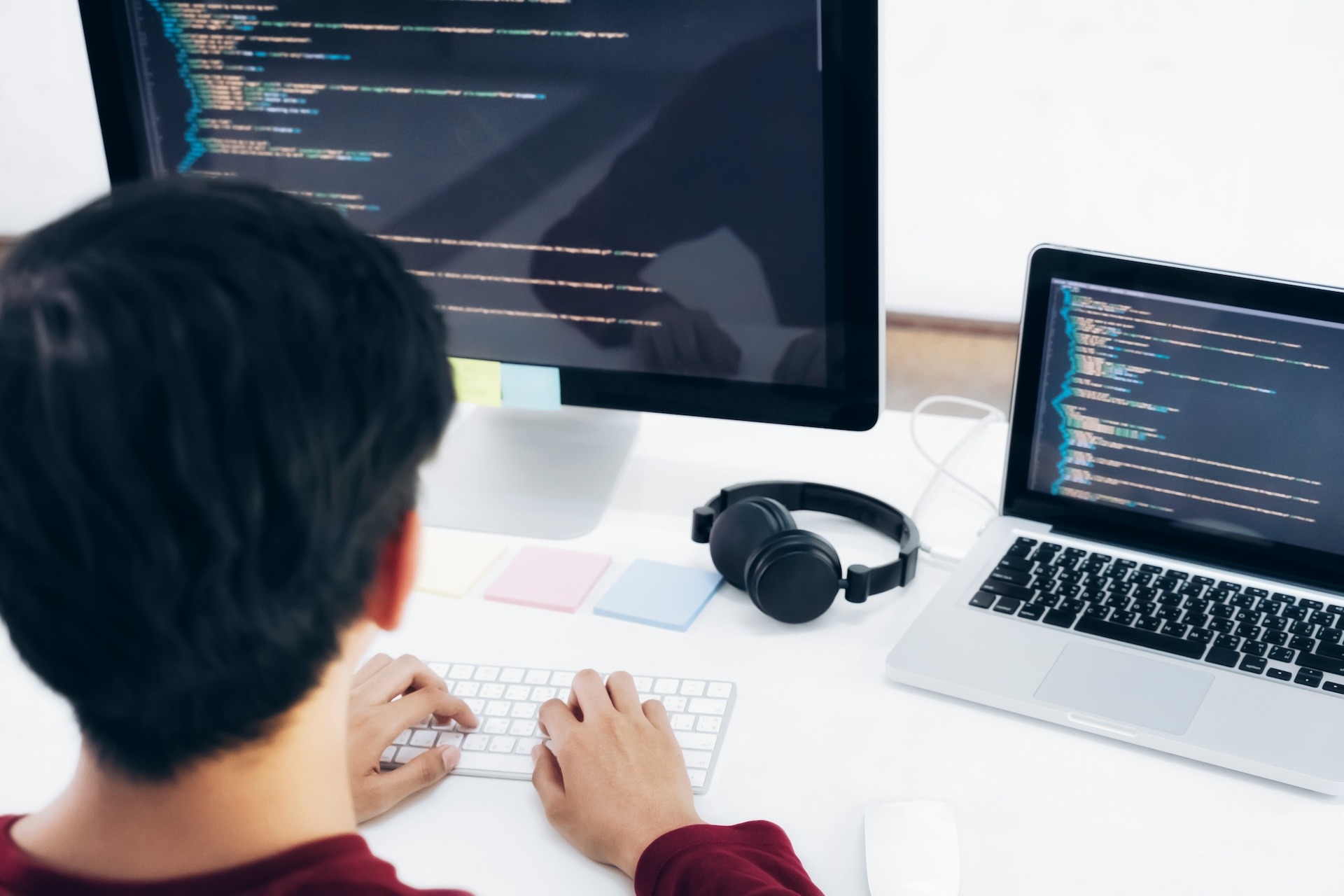 Programmers and developer teams are coding and developing fintech software.
